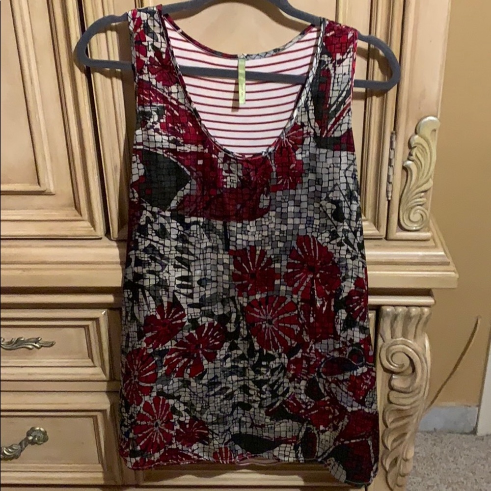 Mosaic red with grey circles top.